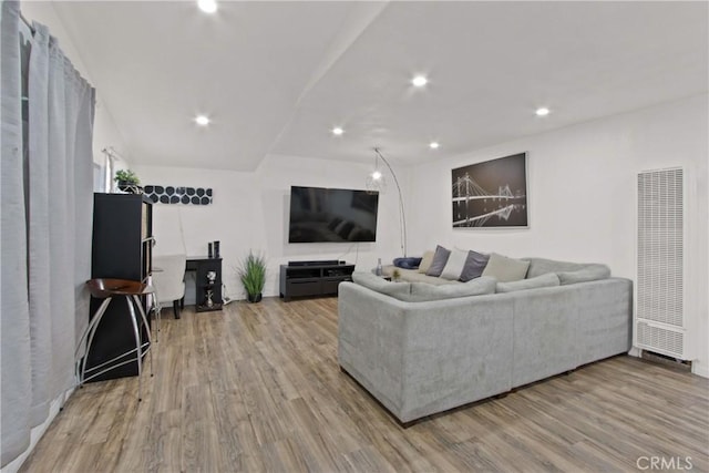 12152 Rosecrans Ave, Norwalk, CA 90650 - living area with a heating unit, wood finished floors, and recessed lighting