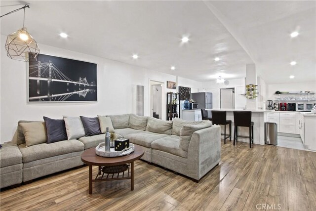 12152 Rosecrans Ave, Norwalk, CA 90650 - living room featuring light wood-type flooring and recessed lighting