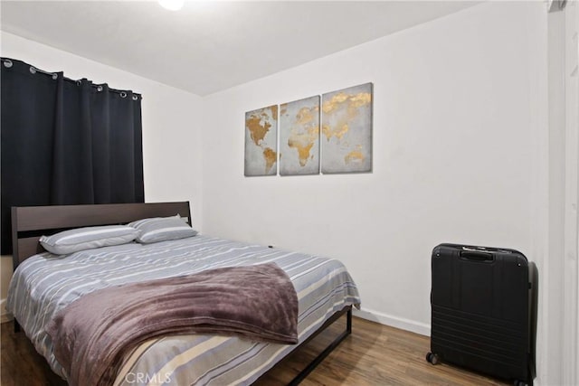 12152 Rosecrans Ave, Norwalk, CA 90650 - bedroom featuring wood finished floors and baseboards