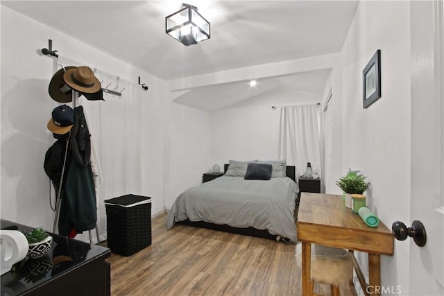 12152 Rosecrans Ave, Norwalk, CA 90650 - bedroom featuring wood finished floors and lofted ceiling