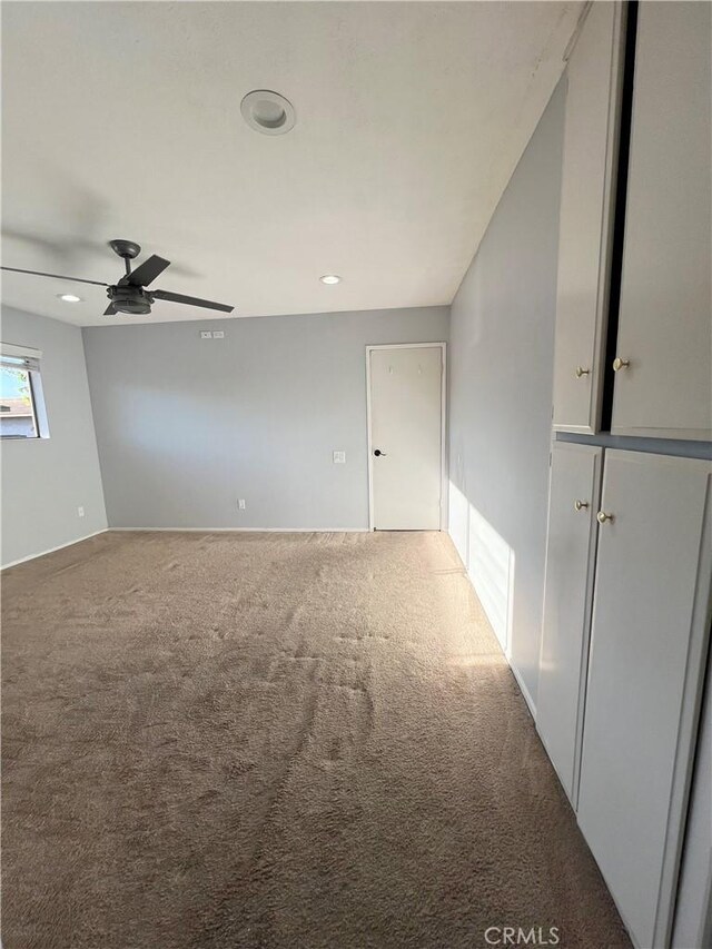 17760 Palo Verde Ave Unit 27, Cerritos, CA 90703 - unfurnished room with carpet floors and a ceiling fan