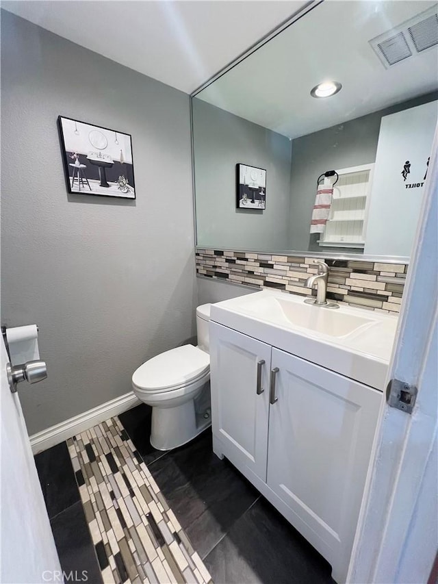 17760 Palo Verde Ave Unit 27, Cerritos, CA 90703 - bathroom featuring vanity, baseboards, backsplash, toilet, and visible vents