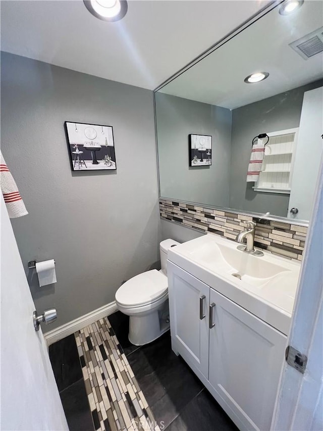 17760 Palo Verde Ave Unit 27, Cerritos, CA 90703 - bathroom featuring tasteful backsplash, vanity, baseboards, toilet, and visible vents