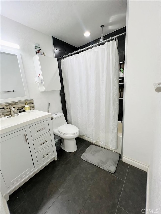 17760 Palo Verde Ave Unit 27, Cerritos, CA 90703 - bathroom featuring toilet, shower / bath combo with shower curtain, vanity, tile patterned floors, and decorative backsplash