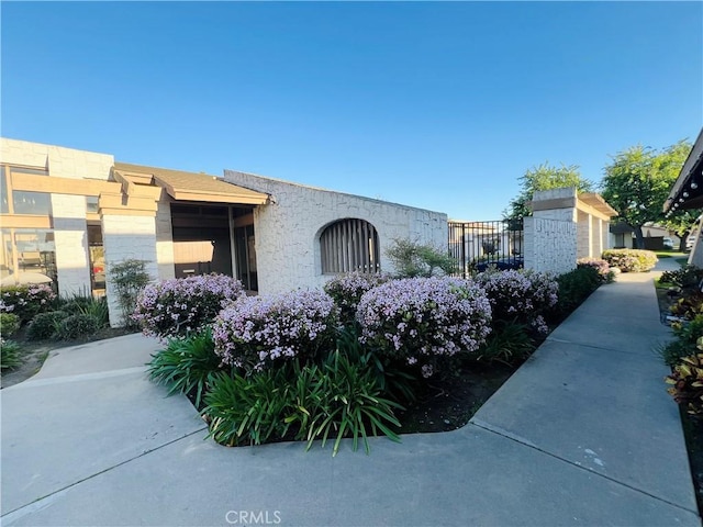 17760 Palo Verde Ave Unit 27, Cerritos, CA 90703 - view of home's exterior with stone siding