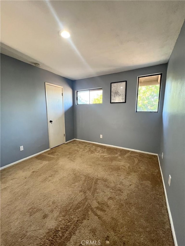 17760 Palo Verde Ave Unit 27, Cerritos, CA 90703 - empty room with carpet flooring and baseboards