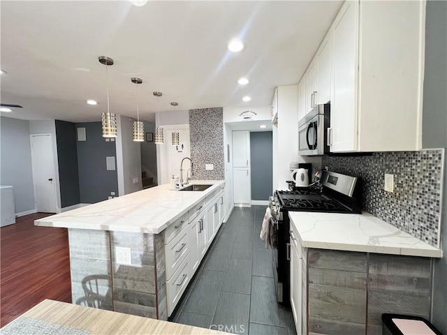 17760 Palo Verde Ave Unit 27, Cerritos, CA 90703 - kitchen with stainless steel appliances, tasteful backsplash, white cabinets, and a sink