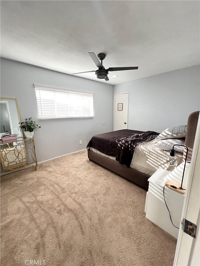 17760 Palo Verde Ave Unit 27, Cerritos, CA 90703 - bedroom with baseboards, a ceiling fan, and carpet floors