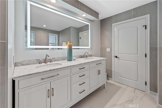 23625 Summit Dr, Calabasas, CA 91302 - bathroom featuring double vanity, marble finish floor, and a sink