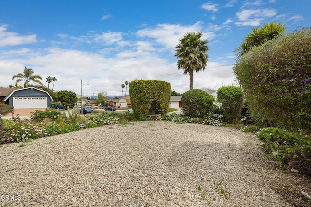 view of yard with a garage