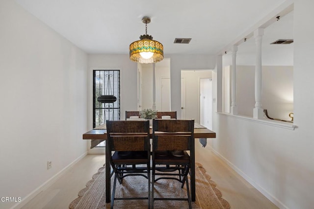 dining space featuring baseboards and visible vents