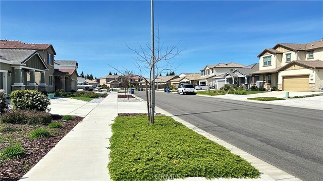 2428 Freestone Dr, Merced, CA 95340 - view of asphalt street with a residential view and sidewalks