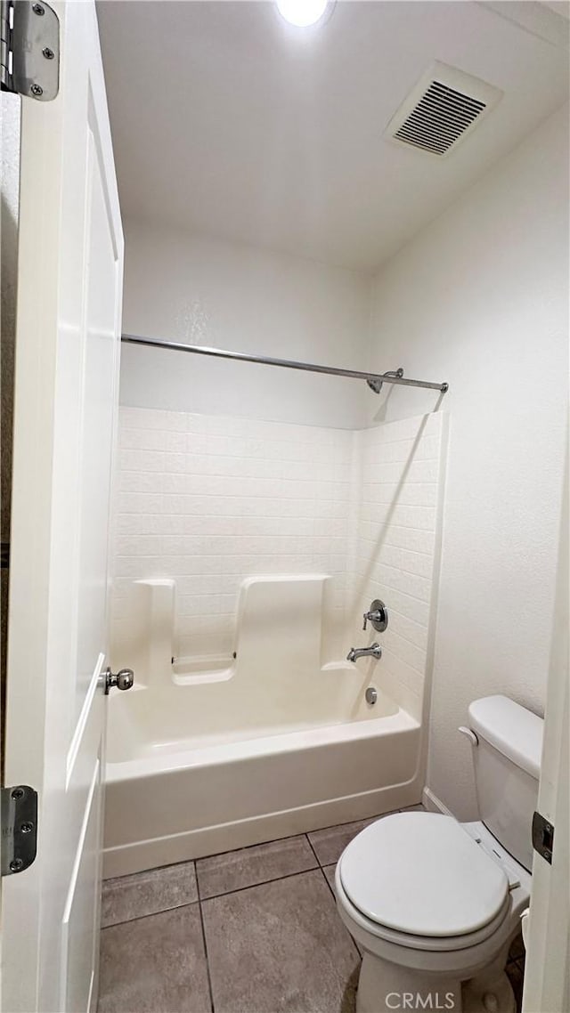bathroom with toilet, shower / tub combination, tile patterned flooring, and visible vents