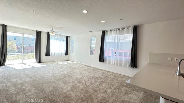 2428 Freestone Dr, Merced, CA 95340 - carpeted spare room with plenty of natural light, a textured ceiling, ceiling fan, and recessed lighting