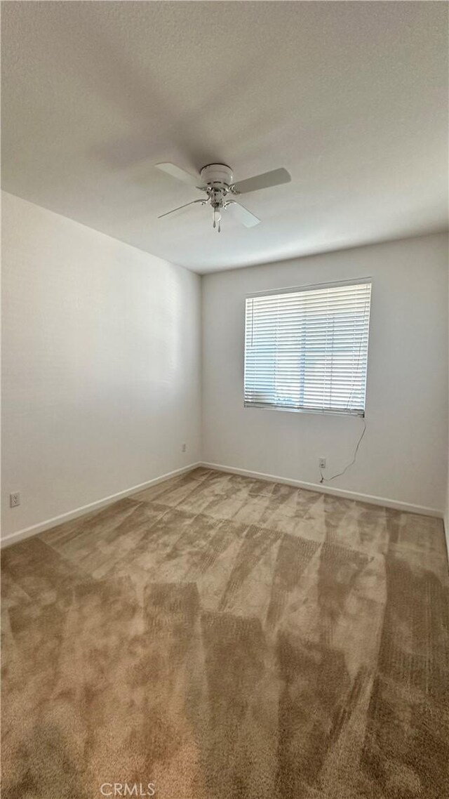 2428 Freestone Dr, Merced, CA 95340 - empty room featuring carpet flooring and ceiling fan