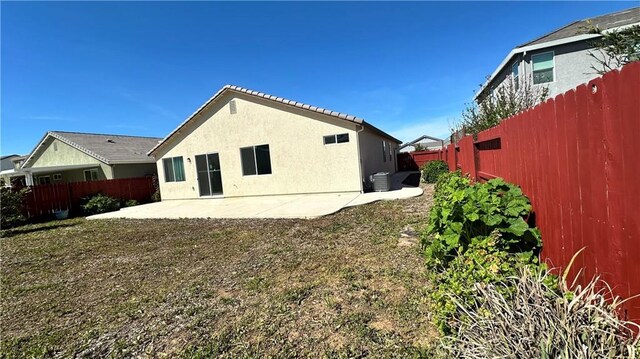 2428 Freestone Dr, Merced, CA 95340 - rear view of property featuring a patio area, a fenced backyard, and stucco siding
