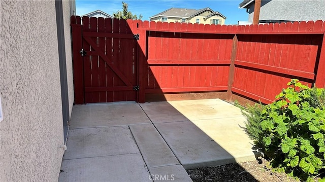 view of gate with fence