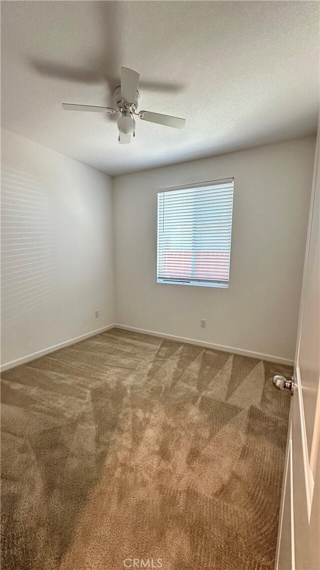 2428 Freestone Dr, Merced, CA 95340 - unfurnished room with carpet flooring and a ceiling fan
