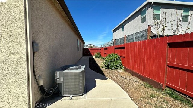 2428 Freestone Dr, Merced, CA 95340 - view of property exterior featuring stucco siding, a fenced backyard, and a patio area