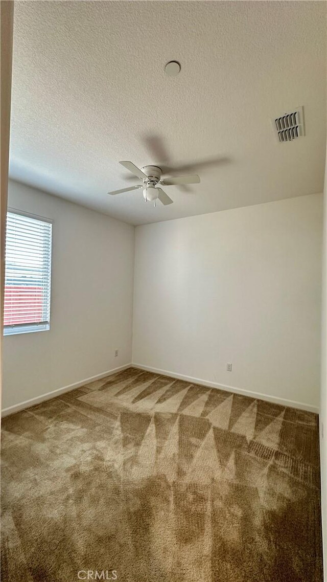 2428 Freestone Dr, Merced, CA 95340 - carpeted spare room with a ceiling fan and a textured ceiling