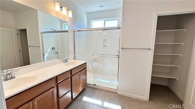 2428 Freestone Dr, Merced, CA 95340 - full bath with a shower stall, tile patterned flooring, and double vanity