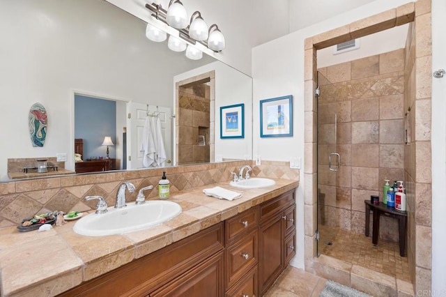2722 Penkea Dr, Oceanside, CA 92054 - ensuite bathroom with a shower stall, double vanity, and tasteful backsplash