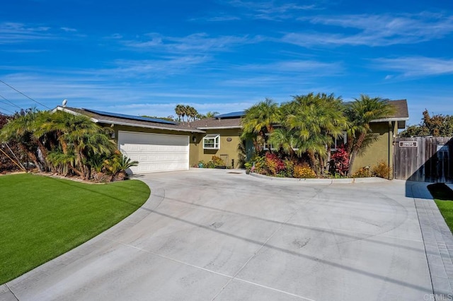 2722 Penkea Dr, Oceanside, CA 92054 - ranch-style home featuring roof mounted solar panels, concrete driveway, a garage, and stucco siding