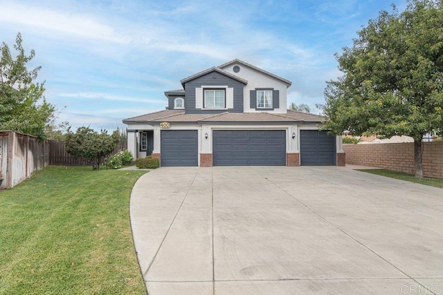 view of front facade with driveway, a front yard, fence, brick siding, and a garage