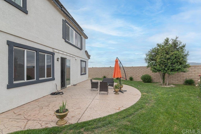 400 Colt St, San Jacinto, CA 92582 - fenced backyard with a patio area
