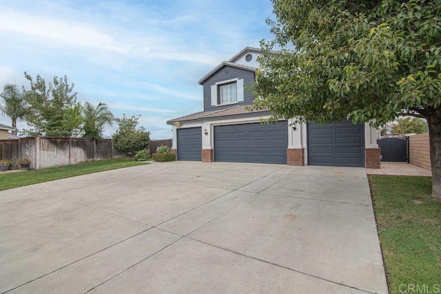 400 Colt St, San Jacinto, CA 92582 - view of front of property with brick siding, concrete driveway, and an attached garage
