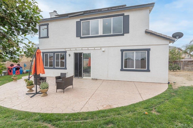 400 Colt St, San Jacinto, CA 92582 - back of house with stucco siding and a patio