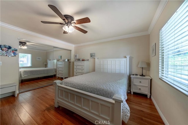 bedroom featuring a ceiling fan, baseboards, ornamental molding, and wood finished floors