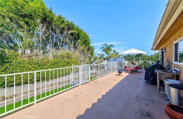 view of patio with a balcony