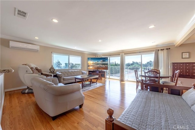 living room featuring crown molding, light wood finished floors, a wall mounted air conditioner, recessed lighting, and visible vents