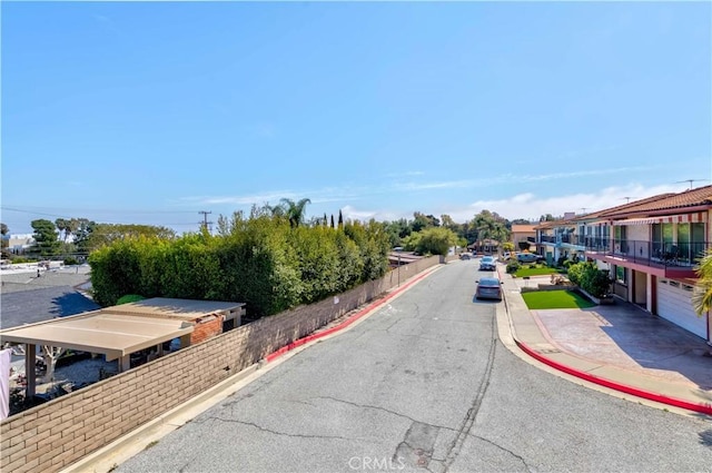 view of road featuring sidewalks and curbs