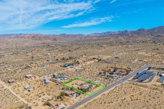 bird's eye view featuring a rural view, a mountain view, and a desert view
