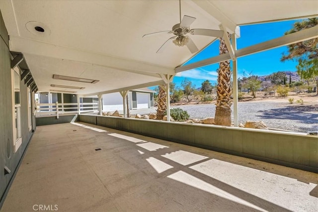 view of patio featuring ceiling fan