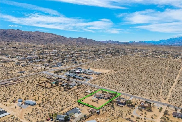 bird's eye view featuring a mountain view, a rural view, and view of desert