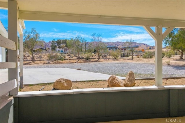 exterior space featuring a mountain view and fence