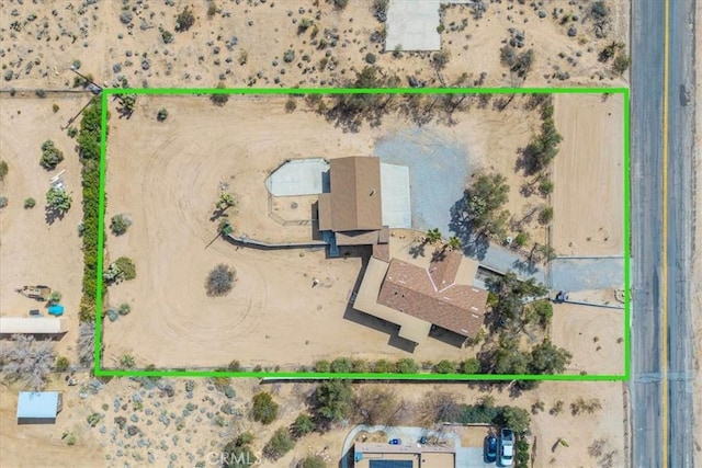 aerial view featuring a desert view