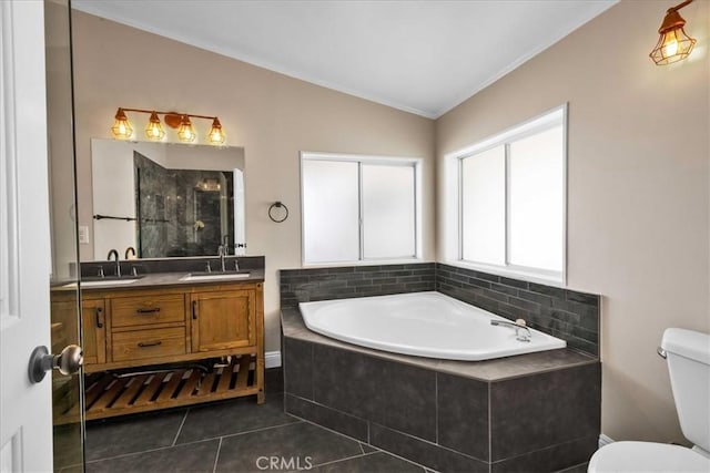 full bath featuring a bath, toilet, lofted ceiling, a sink, and a stall shower