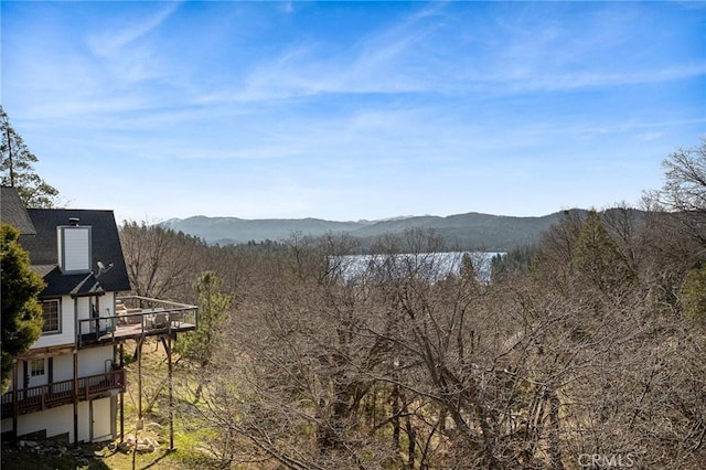 property view of mountains featuring a view of trees