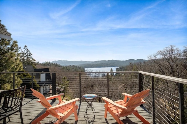 balcony with a water and mountain view