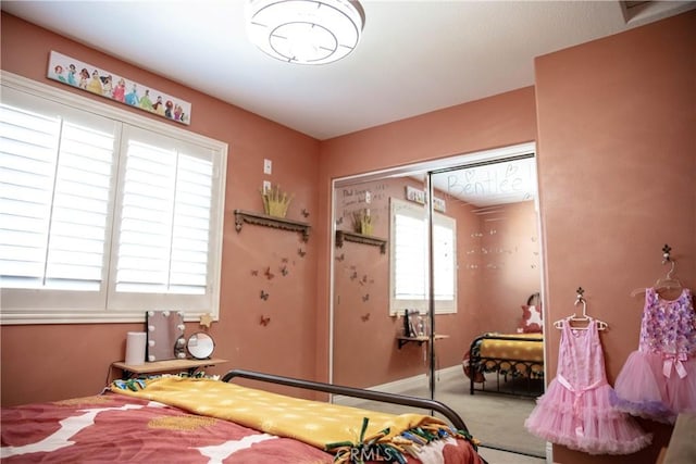 bedroom with a closet and carpet flooring