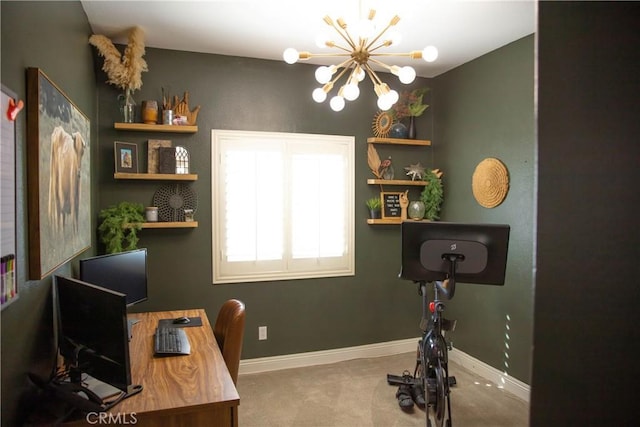 office space with carpet flooring, a notable chandelier, and baseboards