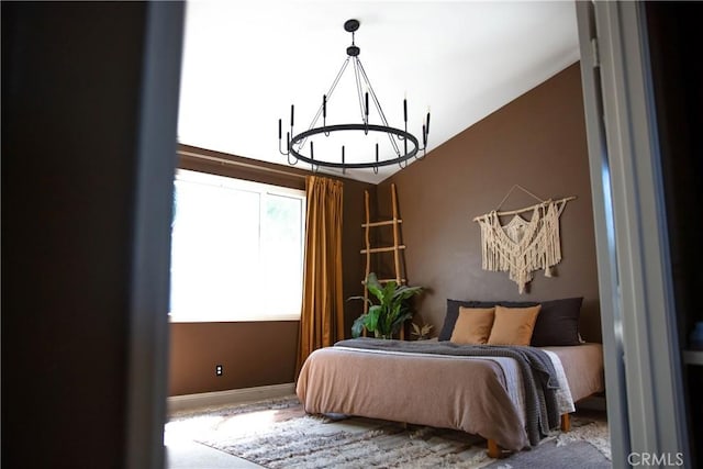 bedroom featuring an inviting chandelier