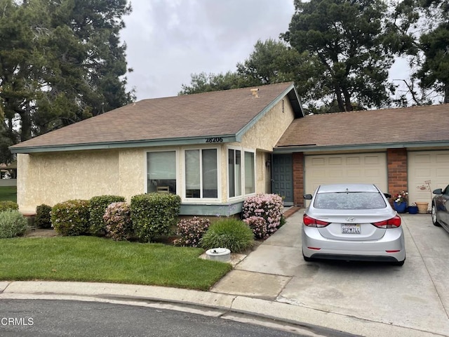 28206 Village 28, Camarillo, CA 93012 - single story home with a garage, concrete driveway, a front lawn, stucco siding, and a shingled roof