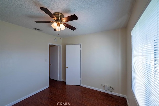 12821 Salisbury St, Baldwin Park, CA 91706 - spare room featuring ceiling fan, a textured ceiling, visible vents, wood finished floors, and baseboards