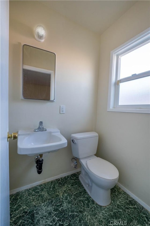 12821 Salisbury St, Baldwin Park, CA 91706 - bathroom featuring baseboards, a sink, and toilet