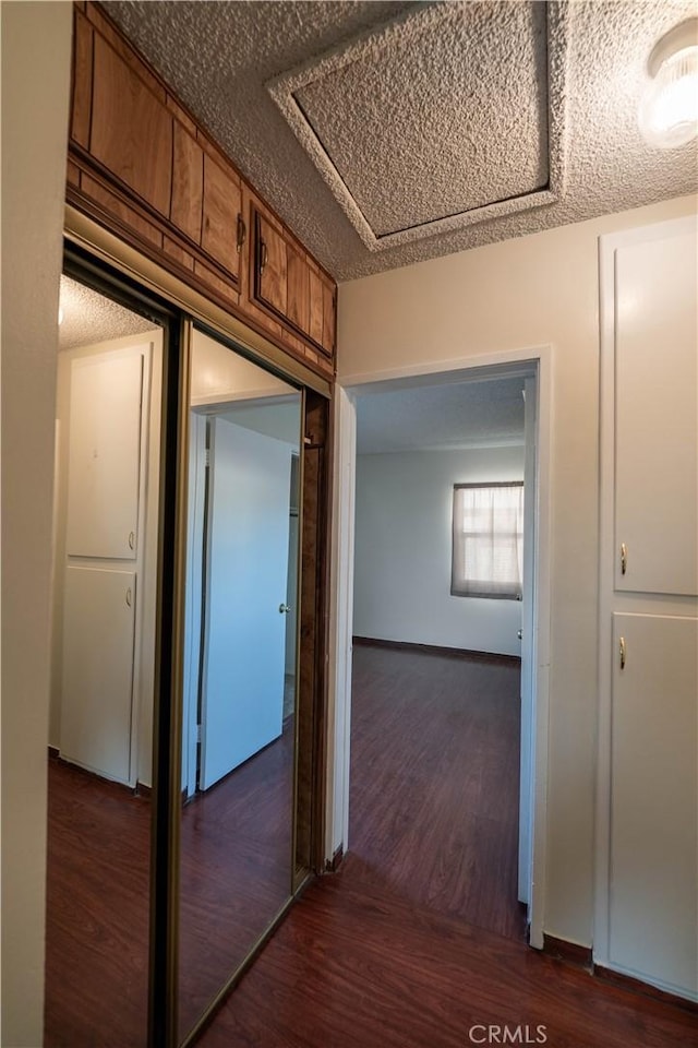 12821 Salisbury St, Baldwin Park, CA 91706 - hallway with dark wood-type flooring and a textured ceiling